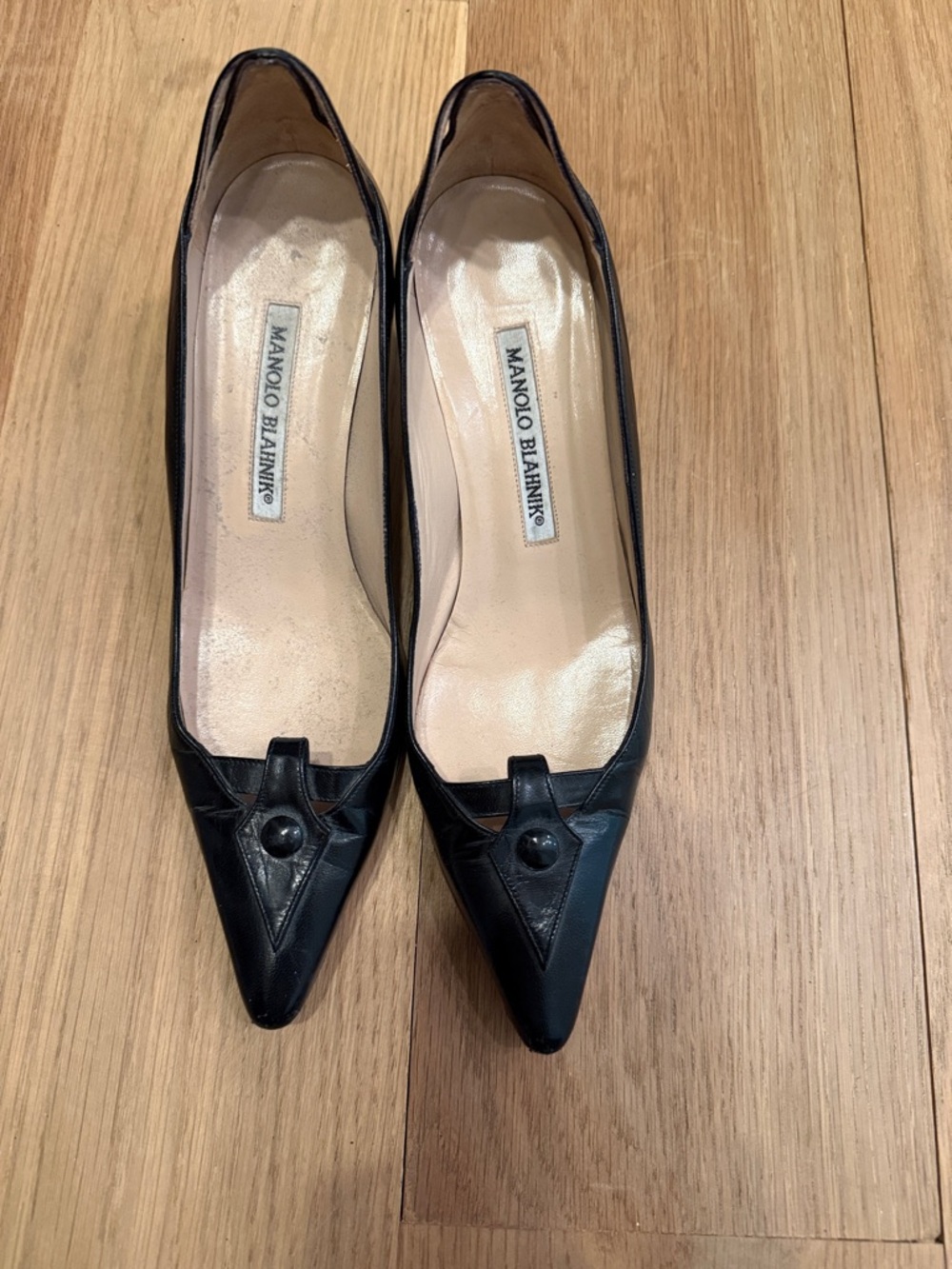 Manolo Blahnik Black Pointed-Toe Leather Pumps with Button Detail